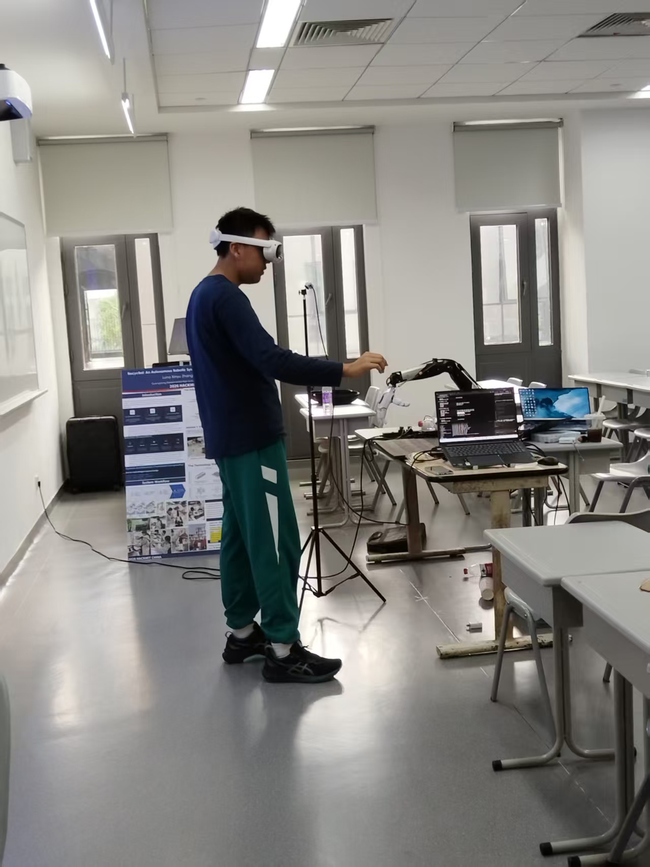 Team member wearing a VR headset while testing teleoperation with the robot system.