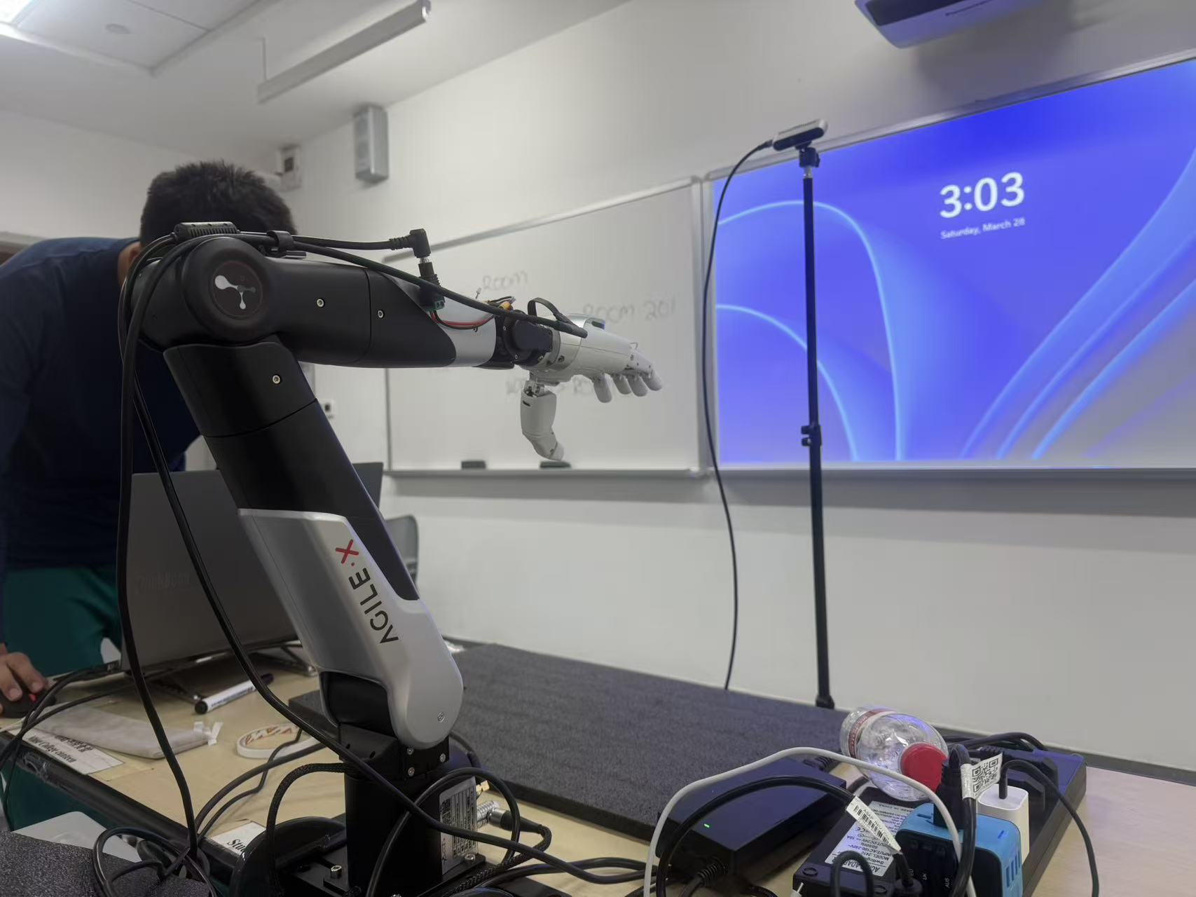 The robotic arm positioned in its working area before a sorting run.