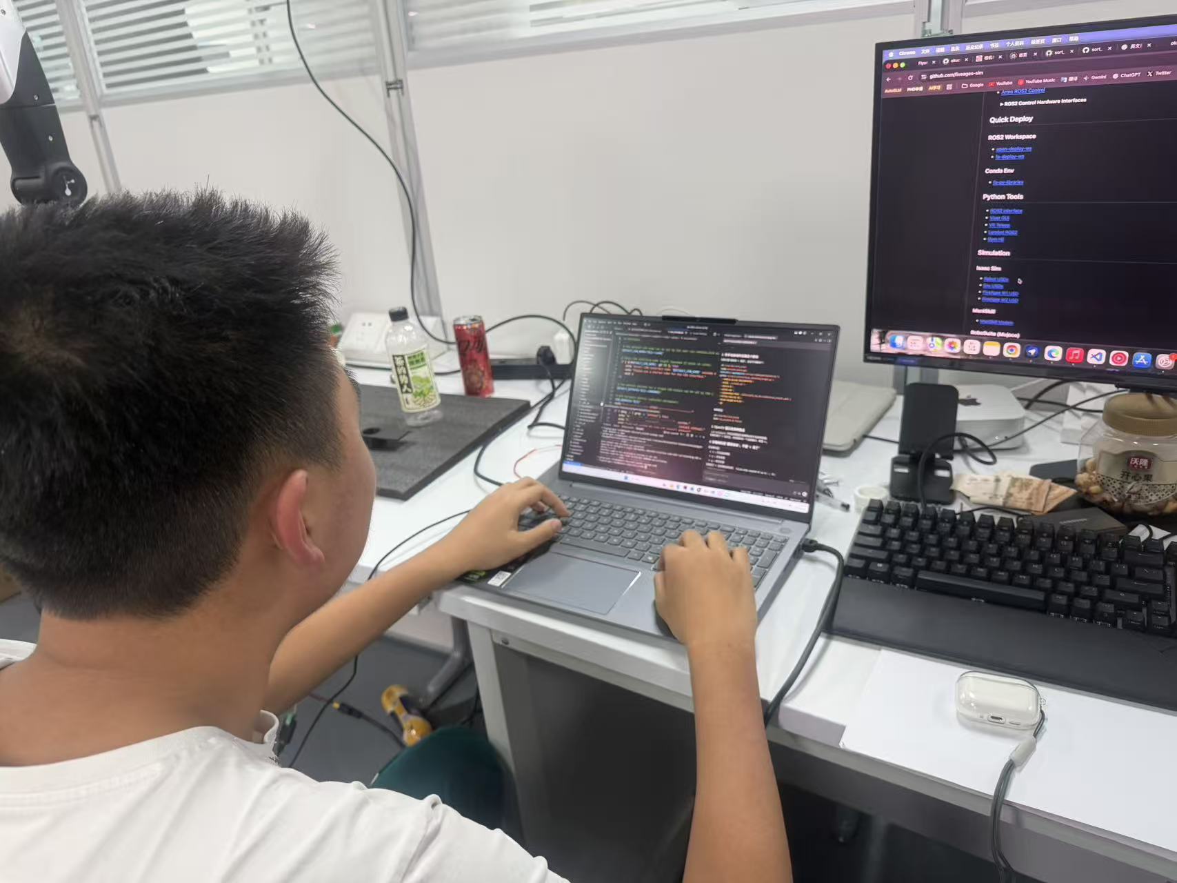 Team member writing control software for the robotic sorting system.